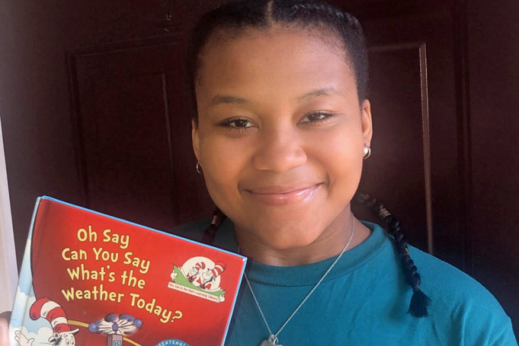 Caria Monroe with children's book 