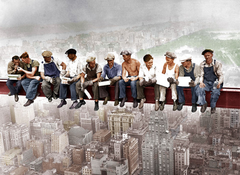 Period photo of construction workers taking a break on a sky scraper beam