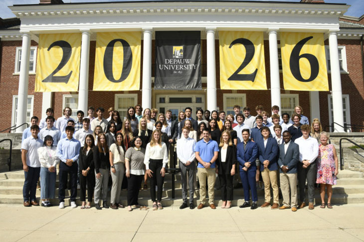 group photo in front of sign