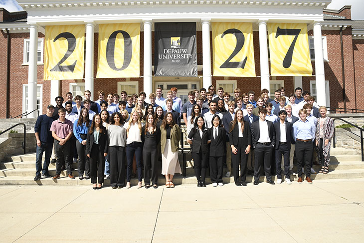 class photo in front of building