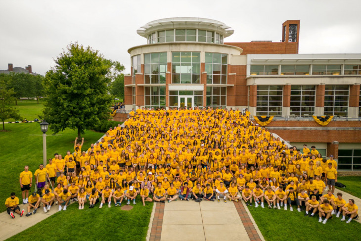 Class of '26 first day shot -- mass of gold T-shirts