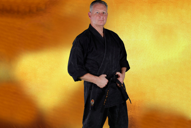 Man in black karate outfit