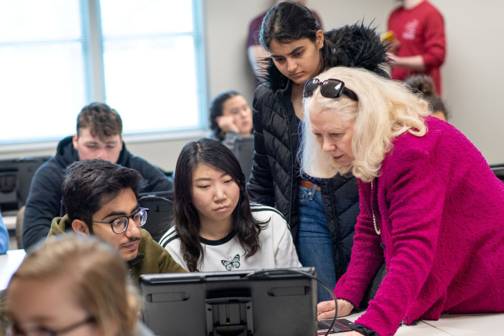 Gloria Townsend works with students in lab