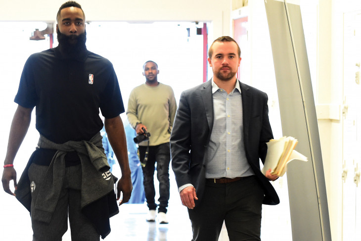 David Dietz (r) escorts Houston Rocket James Harden