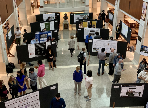 Students presenting their research at the campus poster session