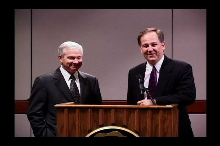 Robert Gates behind a lectern with Ken Owen