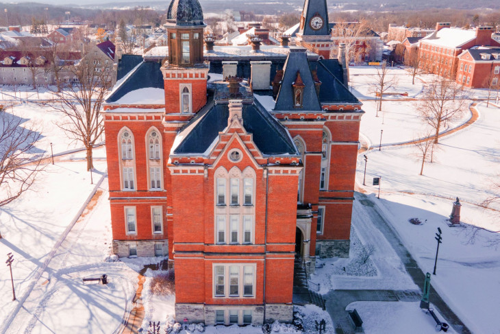 East College in snow-covered campus - drone shot