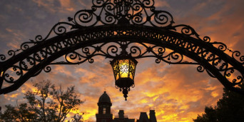 The alumni gates on Locust Street at dusk