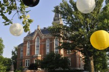 East College with white and gold lanterns in the foreground