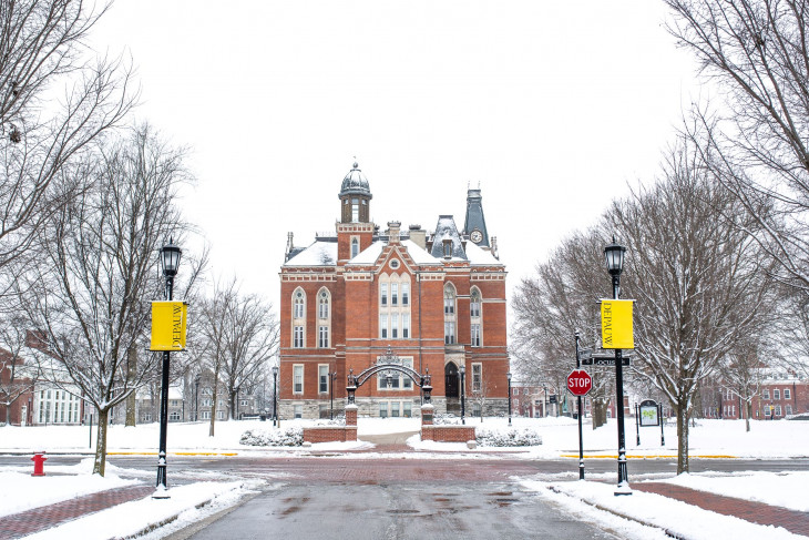 Snowy campus shot featuring East College 