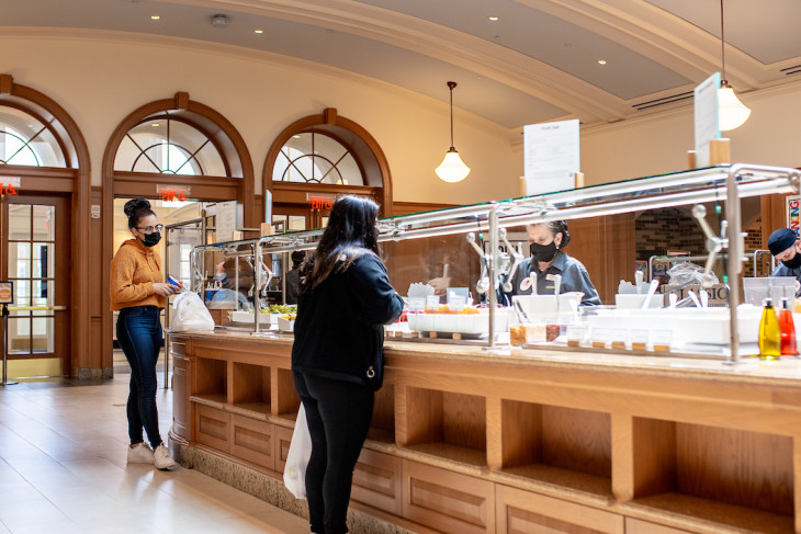 Students standing at the salad bar in Hoover Hall's servery