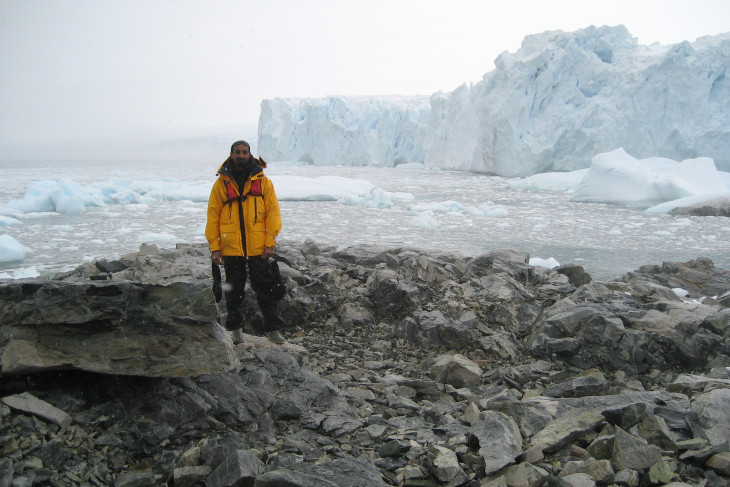 Sam Patel stands on a desolate Antarctica 