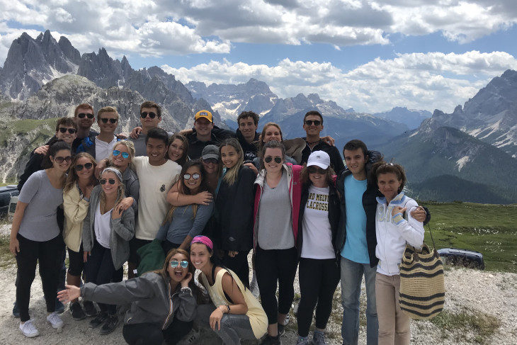 A group of approximately 20 students standing with Professor Francesca Seaman in the Dolomites in Italy.