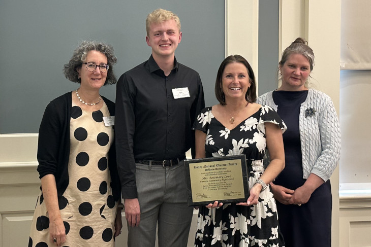 Battey Award winner poses with award at ceremony