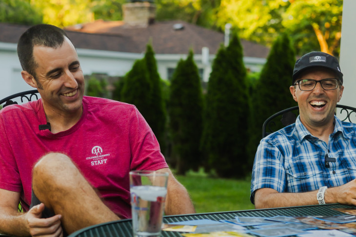 Matt DeLeon and Eric Fruth laugh together outside