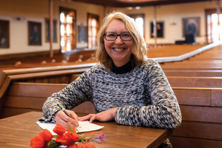 Jen Adams writing a letter in Meharry Hall