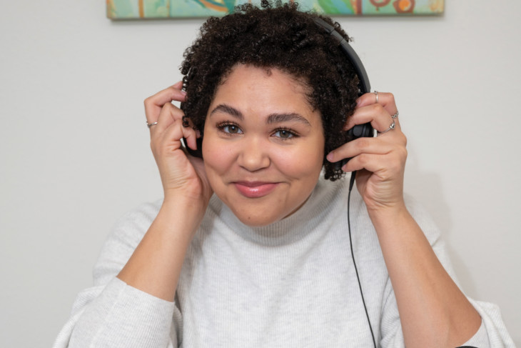 Lauren Clark '11 wearing headphones