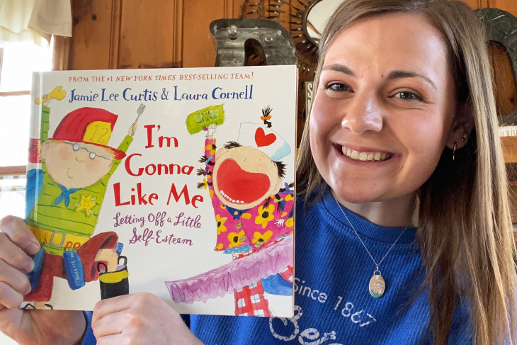 Maddie Dixon with children's book 