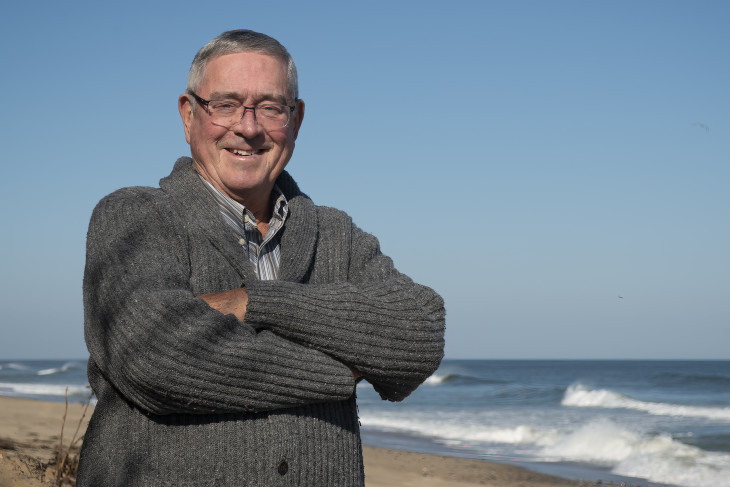 Michael Snell '67 stands on a beach in Cape Cod