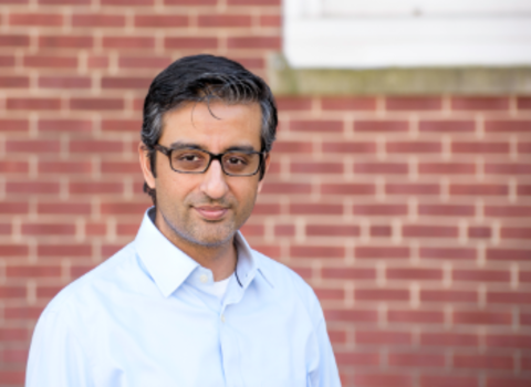 Nahyan Fancy headshot with brick background