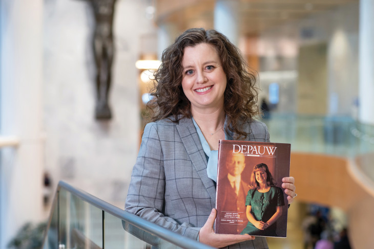 Erin O’Brien ’96 holding the DePauw Magazine with her on the cover