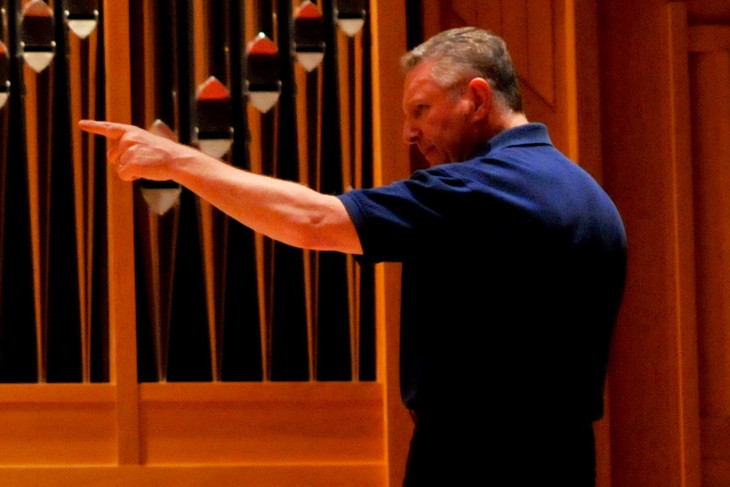 Craig Pare conducts music ensemble