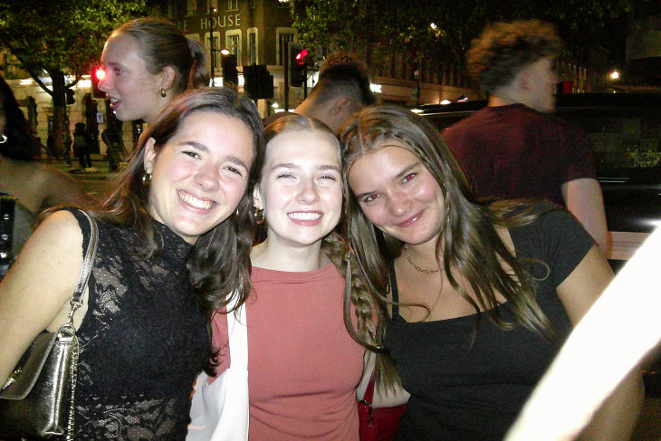 3 study abroad students posing and smiling together