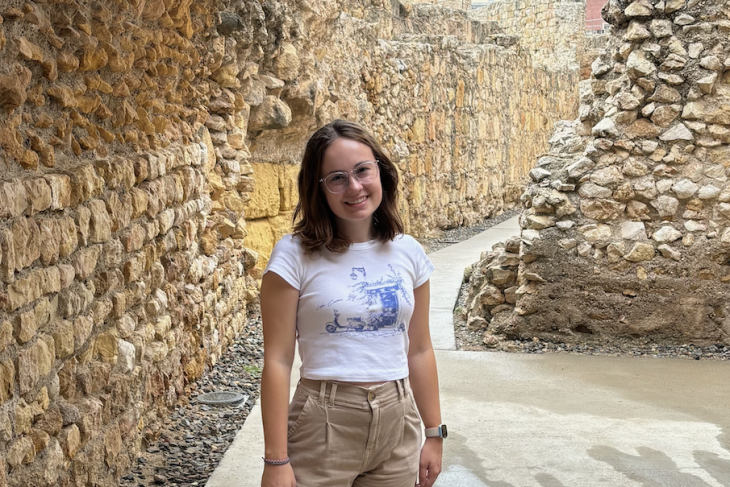 Study abroad student posing with a rocky background