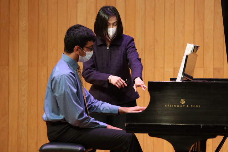 Two people at a piano