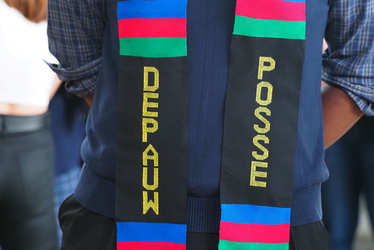 A graduate wears a Posse stole at commencement