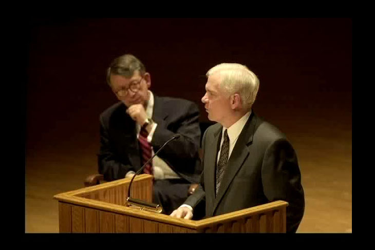 Robert Gates delivering an Ubben Lecture with Bob Bottoms looking on