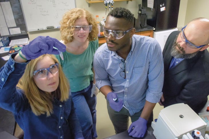 Sharon Crary with students in the lab
