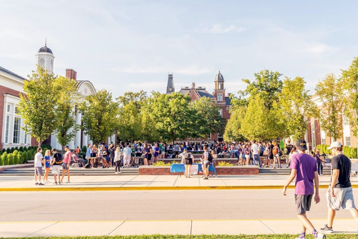 Students and families gather in Stewart Plaza during an event on DePauw's campus.