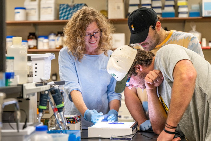 Professor Sharon Crary in the lab with students