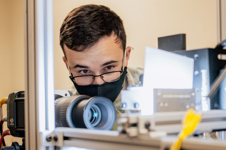 Ben Wilkerson ’24 works with his droplet-on-demand device