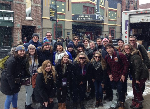 Professors Graham and Wright posing with Winter Term students in front of the 2017 Sundance Film Festival