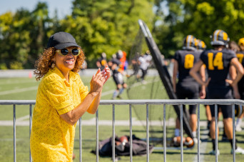 President White cheers on the DePauw Tiger's football team