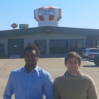 Danny Schultz and KeVeon White strike a pose under Danny's hometown "Florence Y'all" Watertower after the Gateway Debate Tournament (2017).