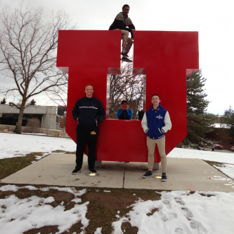 The DePauw Debate Team enjoys the refreshing mountain air at the 2019 NPDA National Tournament at the University of Utah. Bottom Row (left to right): Lucas Taylor, Yong Heo, Liam Byrnes. Top Row: KeVeon White.