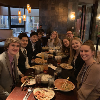 The DePauw Debate Team enjoys a celebratory meal after the 2019 Indiana State Debate Tournament. Left Side (front to back): Alex Spencer, Yuki Harata, Yong Heo, Mana Kunimatsu. Right Side: Sage Klinger, Alayna Trier, Brenna Milligan, Liam Byrnes, Kristina Mikhailova.