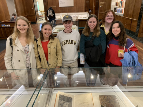 10 Some literary cheer while gathered around the first folio of Shakespeare, though his head is a bit cropped...