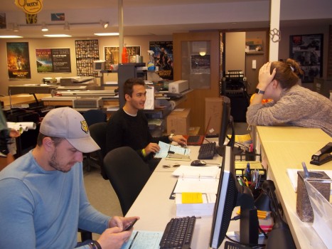 Student working on providing help at printing services