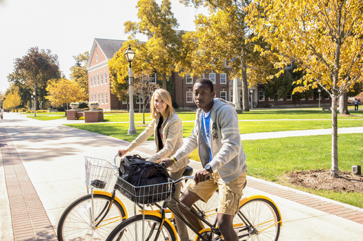 Students riding bicycles in Holton Quadrangle