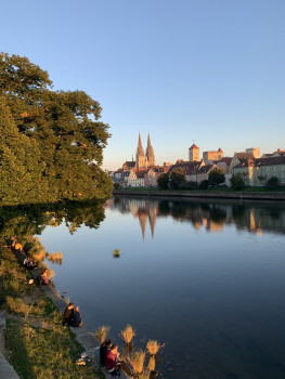 Scenic view of a town in the background of a lake