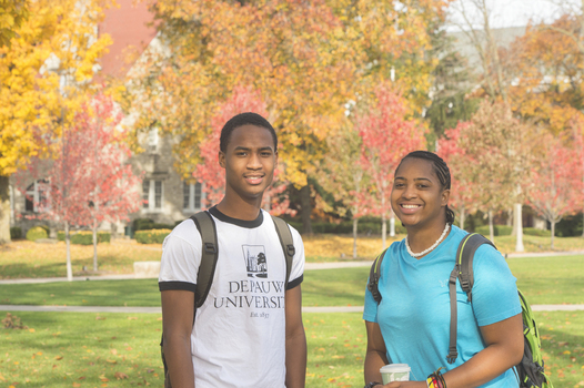 Students standing in Bowman park during fall