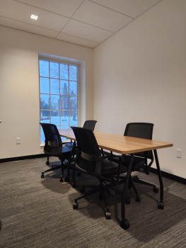 Q Center work area with multiple tables and chairs