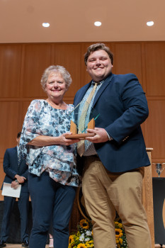 Sandy Smith wins Outstanding Staff Member of the Year Award with DSG President J. D. O'Keane