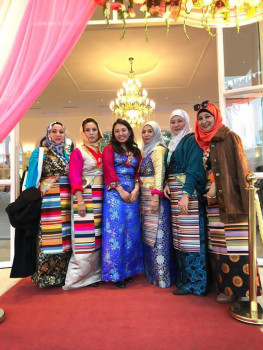 Group of people posing in a ballroom