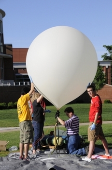 Students working with a high altitude weather balloon