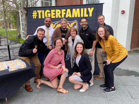 Admission team posing in front of a #TigerFamily banner